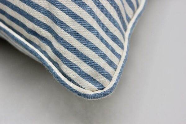 A close up of a Candy Stripe - Blue pillow.