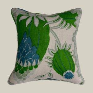 A cushion with Christopher Farr - Carnival Green pattern.