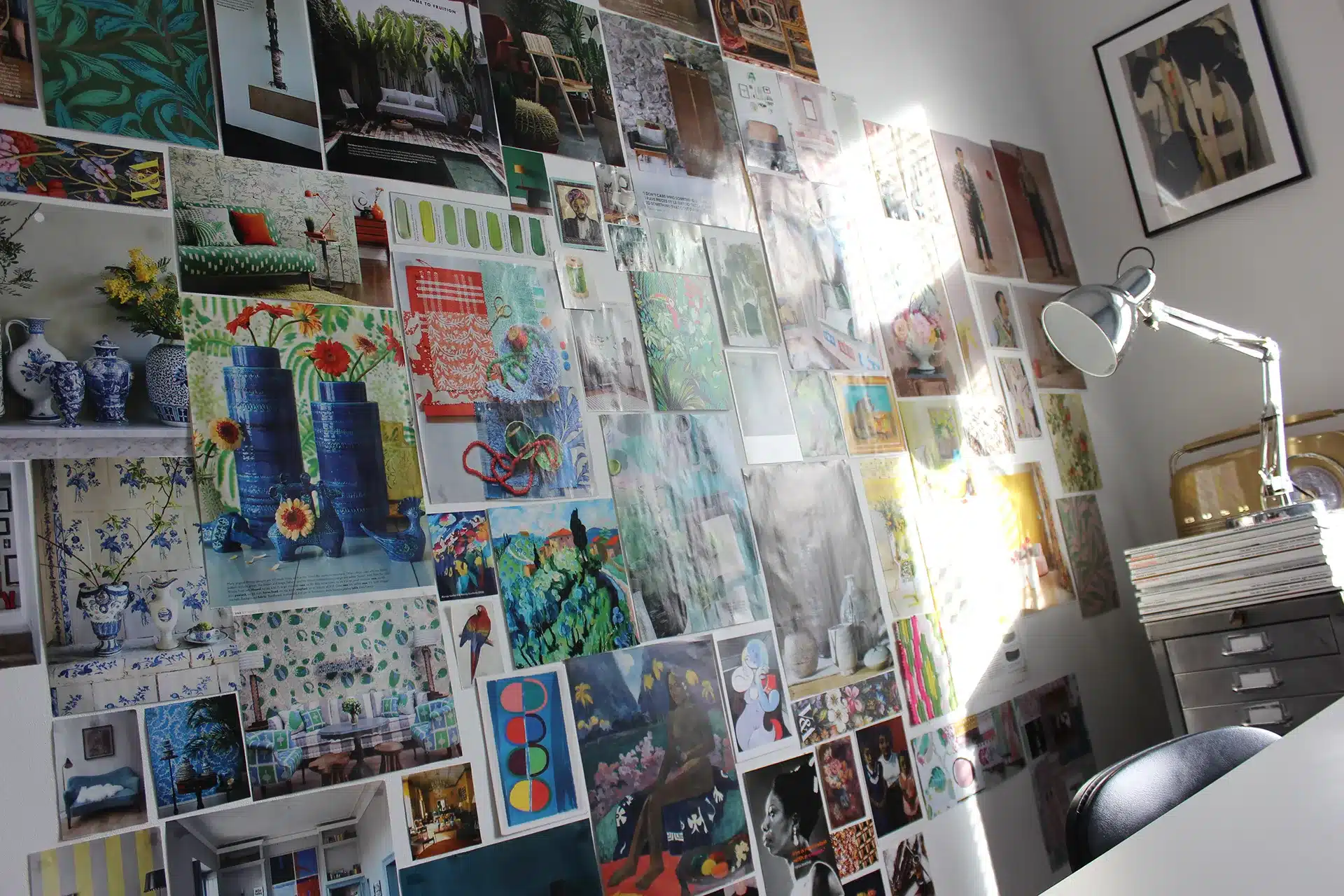 A room with a lot of pictures on the wall.