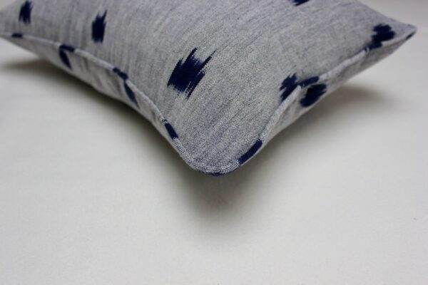 A pillow with a Blue Ikat pattern.