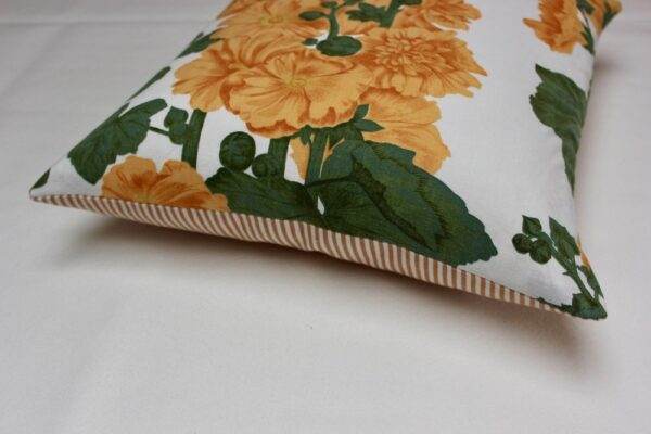 A yellow and white Vintage Liberty x Romo Oswin - Stripe pillow with flowers on it.