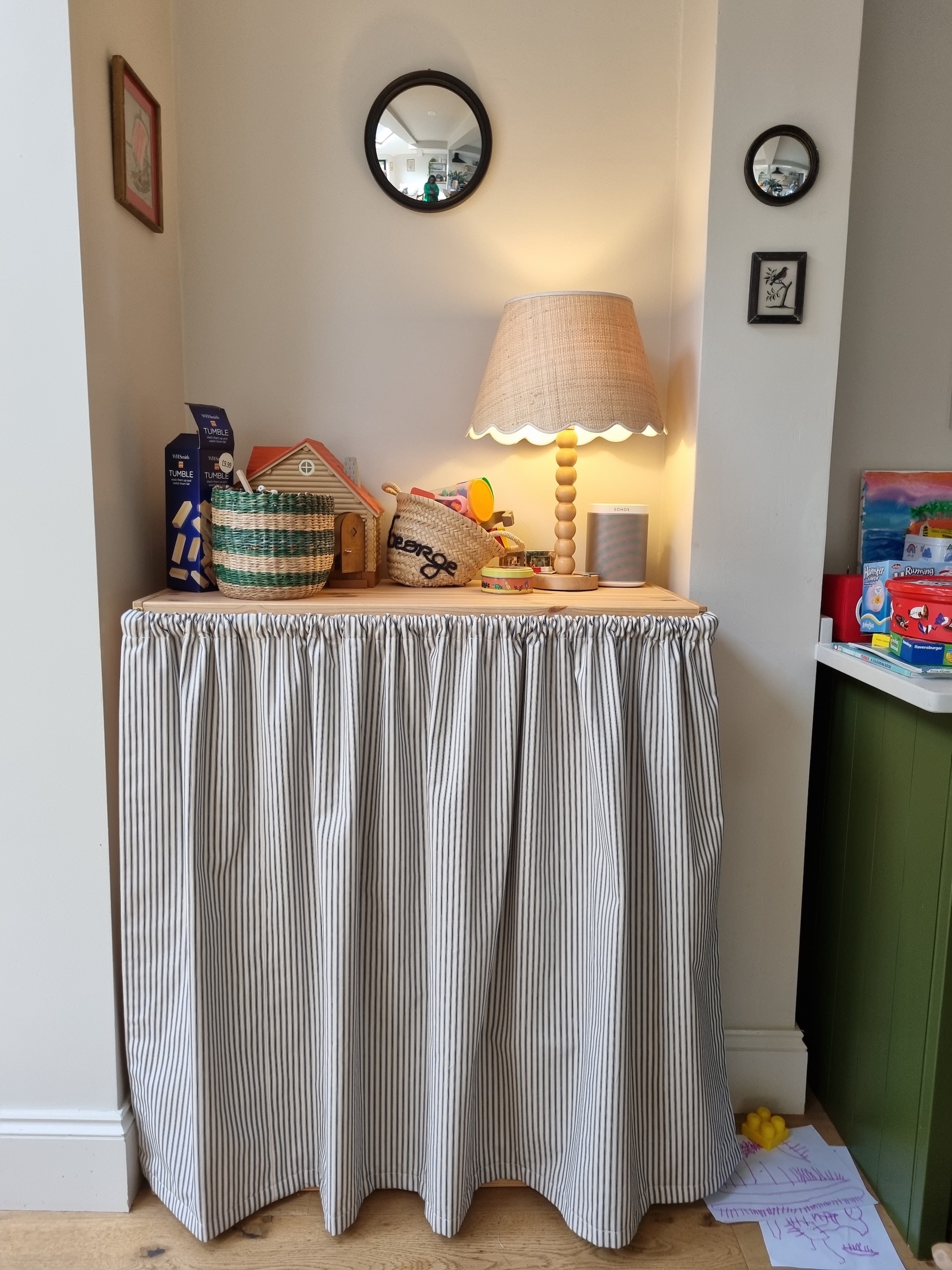 Cafe curtains in ticking stripe, toy storage